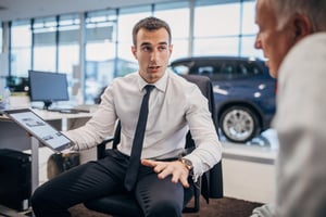 Car dealership employees discussing flaws in data consistency